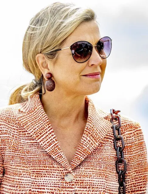 Queen Maxima visited the water scouts at Zeewolde scouting estate. The Queen wore tweed jacket and tweet wide-leg trousers