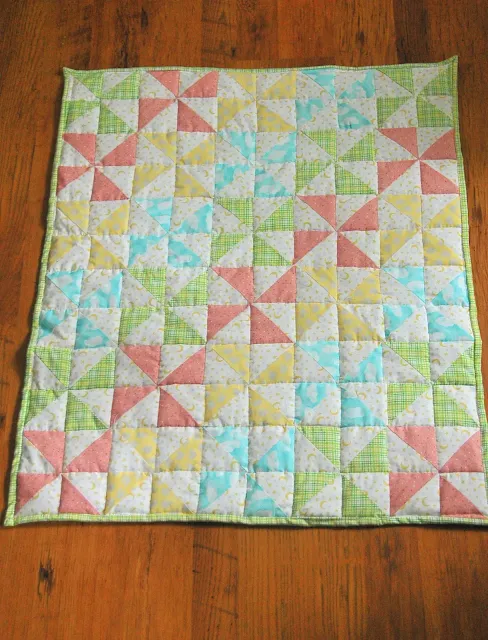 striped pinwheel baby quilt