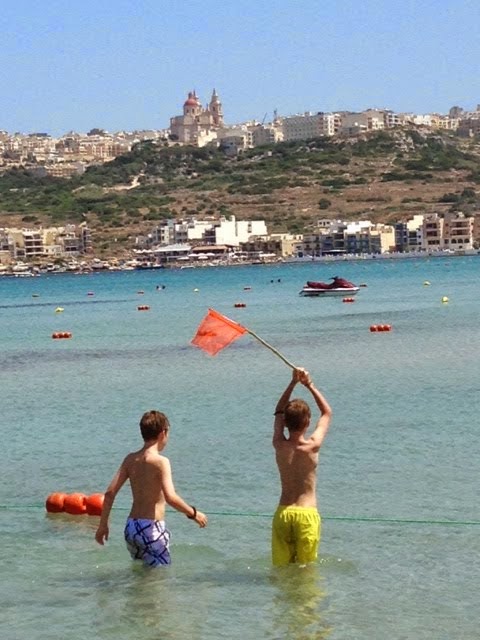 Boys sort of fishing , top of Malta