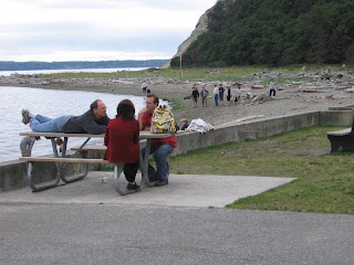 John talking with a German couple at Smugglers Cove beach