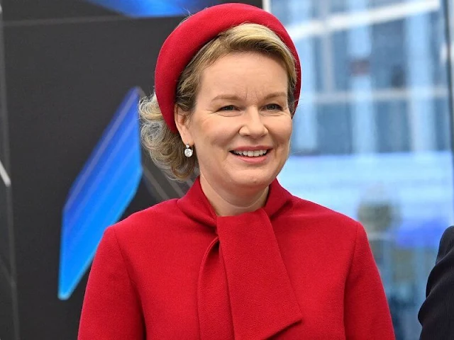 Queen Mathilde wore a hairy mohair red jacket and red wool crepe dress by Natan. Lithuanian First Lady Diana Nausedine