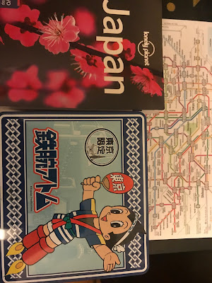 Guidebook cover, Tokyo subway map and an Astroboy lunchbox