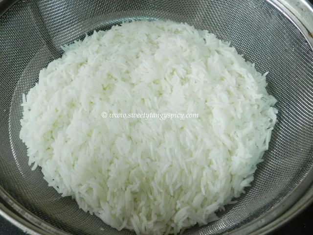 Cooked basmati rice strained through a colander