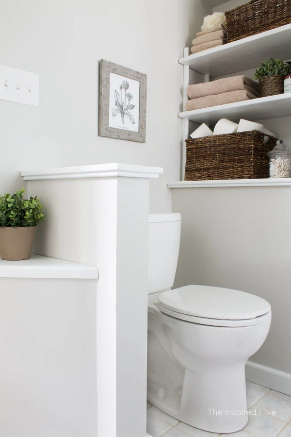 A few simple budget friendly updates to a builder grade bathroom make a big impact! This master bathroom makeover is full of farmhouse charm!