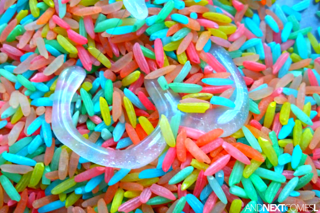 Colored rice sensory bin close up