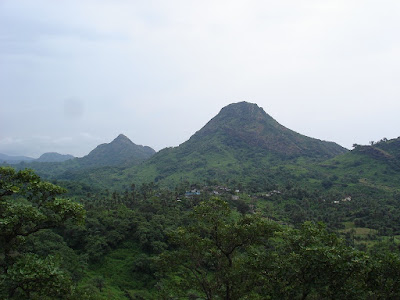 "Mount Abu adorned in green mantle, the hills in the background are Plummy and Sargent Plummy."