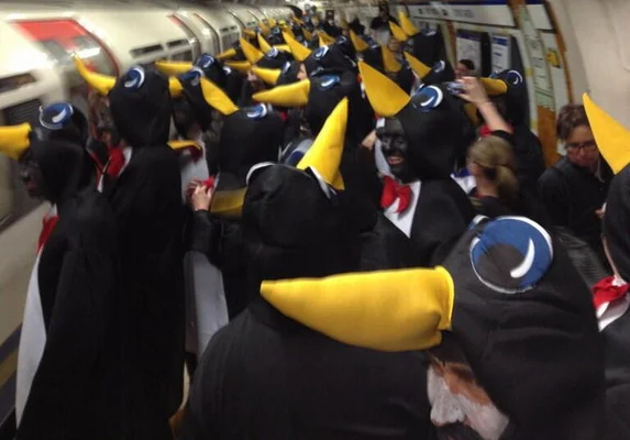 Hartlepool fans dressed up as penguins storm through the London Underground