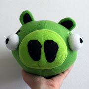 The plush Angry Birds pig, in all his glory. .looking slightly dimwitted .