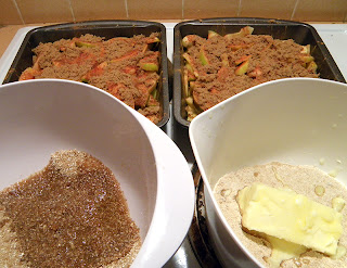 Two Different Bowls of Topping with Two Baking Dishes of Apples