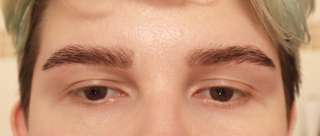A photo of eyebrows after tinting and plucking