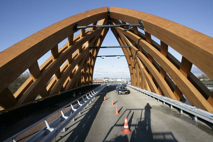 Wood Bridge In Netherland Commissioned by the Province of Friesland, Oak (Onix and Achterbosch Architecture) has developed a road bridge that connects 2 districts of Sneek on either side of the A7 motorway. The bridge was designed for a municipality that wished to establish a new city marker along the motorway. Framework The Department of Public Works, the user of the bridge, stated that it wished to use more wood in its constructions