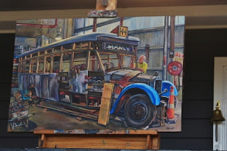 Plein air oil painting of restoration of heritage Manly bus at the Sydney Bus Museum by industrial heritage artist Jane Bennett