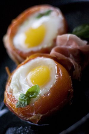 Eggs Baked in Tomatoes with Crisp Prosciutto and Basil