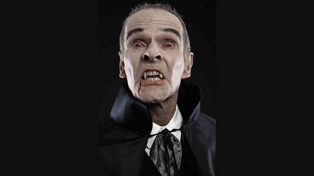 Dracula with black cape showing his scary teeth.images Canvas