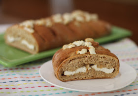 Caramelized garlic and chèvre - goat cheese - fill this wonderful savory loaf that is then topped with more cheese. Set this on your brunch table and watch it disappear!