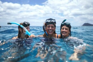 girls-snorkeling-in-water