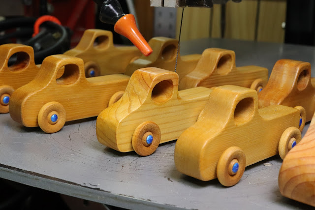 Handmade Wooden Toy Pickup Trucks Ready For Final Inspection