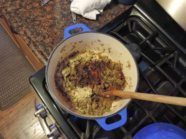 All of the spices being added to the pot. 