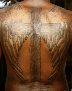 cross back piece tattoo