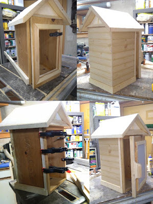 4 pics of our street library under construction shows the side bracing being attached, the beadboard siding, clamps holding the front door edge, & the initial assembly of the final box.