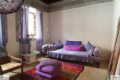Purple  White Bedroom on Warm Red And Purple Textiles Are Balanced By White Walls