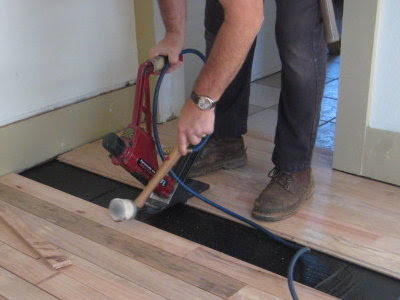 Pneumatic flooring nailer in action