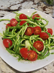 spiralized zucchini in avocado pesto sauce