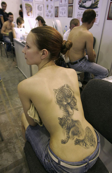 tattoo on back girl. Girl with Cool tiger tattoo on