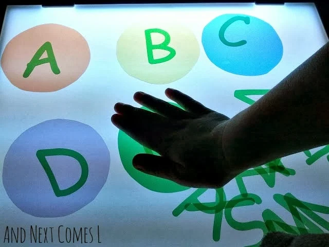 DIY transparent alphabet manipulatives for light table play from And Next Comes L