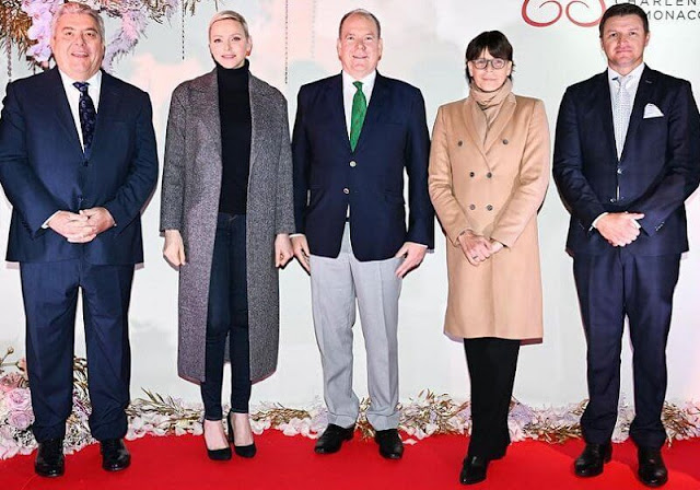 Princess Charlene wore a new Henrik belted cashmere coat by Loro Piana. Prince Albert, Princess Charlene and Princess Stephanie
