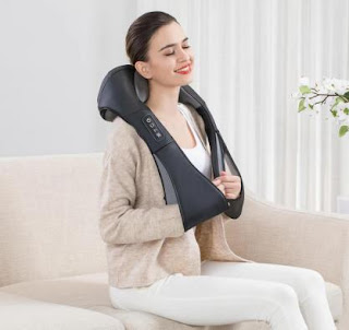 Woman using a neck and shoulder massager