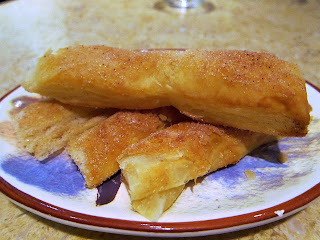 Cinnamon and sugar dusted puff pastry churros