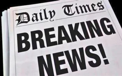 A newspaper with the headline How AI is Changing News