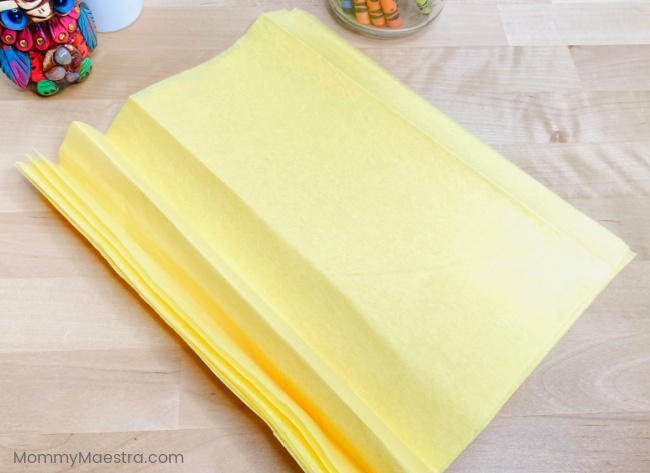 Use a yellow, orange, or golden tissue paper.