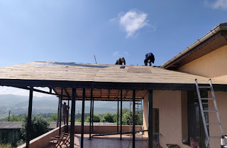 Bekir and Sally working on the roof