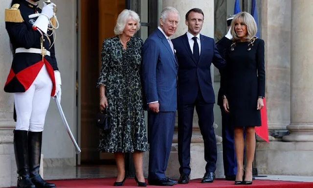 French President Emmanuel Macron and his wife Brigitte Macron. Queen Camilla wore a shirt dress by Samantha Sung
