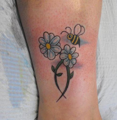 Daisy tattoos are an impressive choice for girls of all ages.