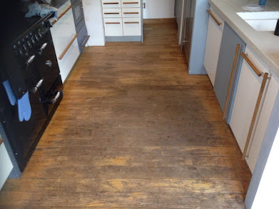 Worn floorboards in the kitchen