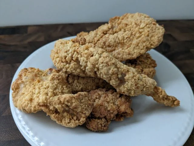 A bag of Tyson Air-Fried Chicken Breast Strips side-view.