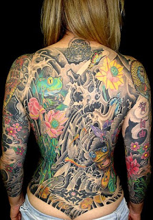 Flower and frog tattoo design on girl's full back body