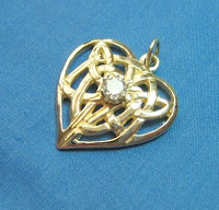 Custom designed gold pendant with diamond by Payne's Custom Jewelry