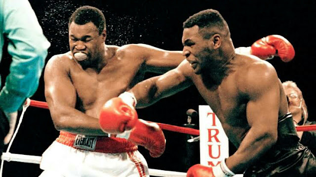 Mike Tyson KOs Larry Holmes