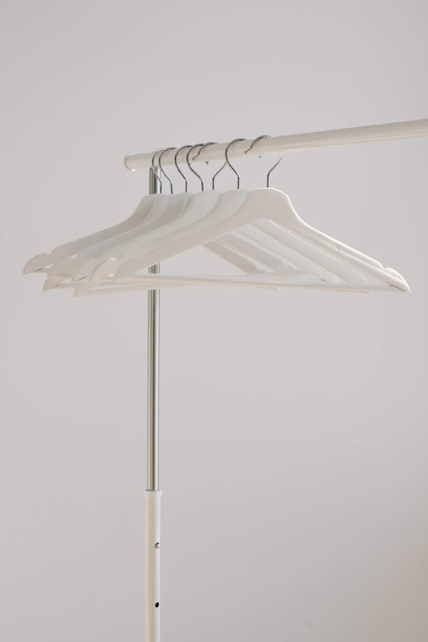 White clothes hangers on rack