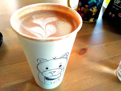 Nutella hot chocolate with latte art even in a takeaway cup.
