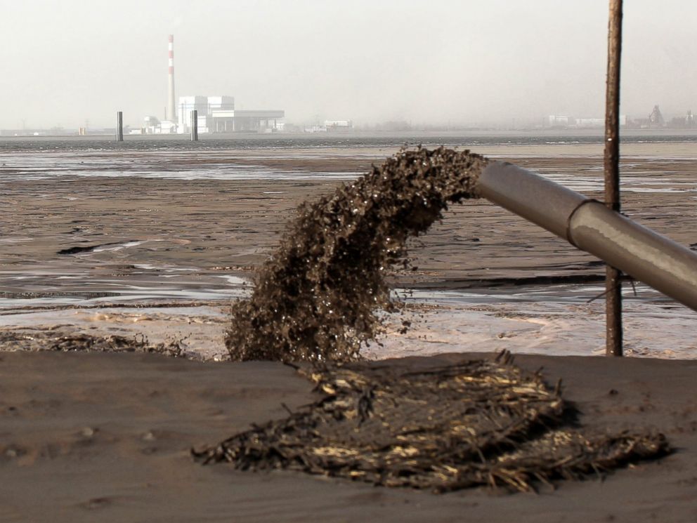 12 Horrifying Photos of the Tech Industry Apple Never Wants You to See - Tech industry mining produces miles-wide lakes of toxic waste.