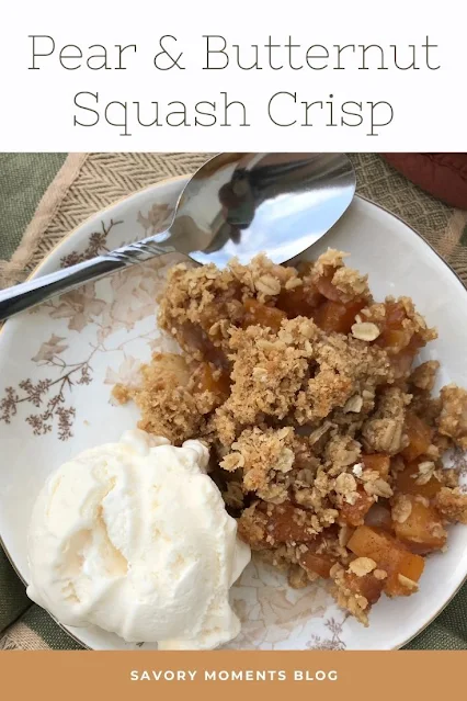 Serving plate of pear and butternut squash crisp with a scoop of vanilla ice cream.