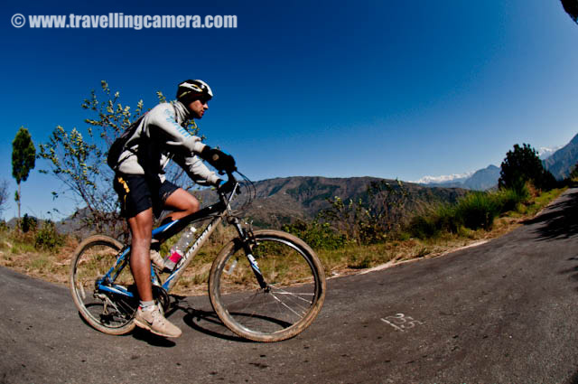 MTB Riders on highest speed in the downhill stretch parallel to snow covered mountain ranges (On Third day) : Posted by VJ SHARMA on www.travellingcamera.com : Hope you have been enjoying this PHOTO JOURNEY through various routes of MTB Himachal 2010... Its 10th post on this great Himalayan event for passionate bike Riders... on third day, I noticed the highest speed of all the riders in a downhill stretch in parallel to snow capped mountain ranges... Check out some of the photographs of this downhill stretch across snow covered hills...First I wanted to give you a feel of the road where we were waiting to catch fast riders of MTB Himachal 2010... Road was situated on a very high hill in parallel to these mountains covered with snow... wonderful place with nice weather and beautiful surroundings...Here comes a group of riders and Cameras are not set to estimate their speed and adjust accordingly... It took time to adjust our cameras to shoot exactly what we wanted to shoot... At least I tried various things with first few riders and was able to identify right place with right settings....They were moving like anything.... Amazing actions, styles n movements...Even folks on the road were moving downwards toward the deep valley to save themselves fom these fast moving riders :) btw he is another Photographer struggling to set himself for shooting this rider...Rider number 41 ... Most of the riders knew each other by their rider numbers and it was difficult to remember the names of everyone but was very easy to know each other by rider nunber because they were sepnding most of the time on the roads crossing each other...Another rider on full speed in the middle of beautiful himalayan mountains in the state of Himachal Pradesh.... Thanks to MTB Himachal 2010...Mr. Ranjan Mandyal playing in air during MTB Himachal 2010... I got a chance to meet some great folks who have passion about bke riding and do lot of other good things in their lives... Ranjan was one of the guy I met and got a chance to understand him better... Hope to meet all of them again :)Here is another MTb rider in style... moving towards the final goal which is near Satluj river near main highway..Amcha rider from Maharshtra Police... a nice photographer as well... He was planning to host an exhibition in Kolkata and also invited us... Hope to see him next year again...Somehow I wanted to share all these photographs in black and white but it would have been unfair to the colorful beauty of surrounding himlayan mountains....Loved this journey and the colors of himalayas...