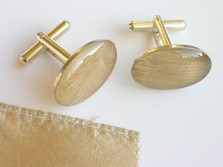 Silver cufflinks containing a piece of wedding dress