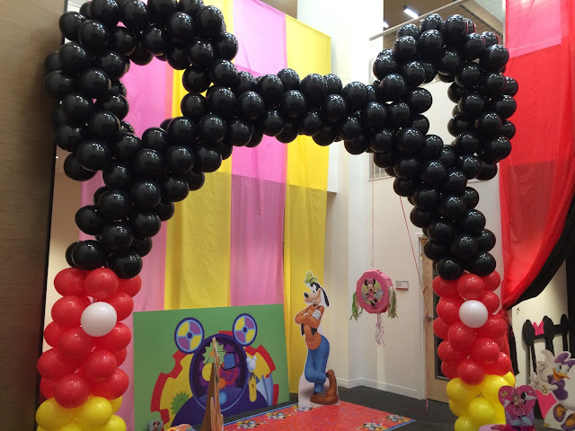 A Balloon Arch of Mickey Mouse created out of hundreds of round balloons