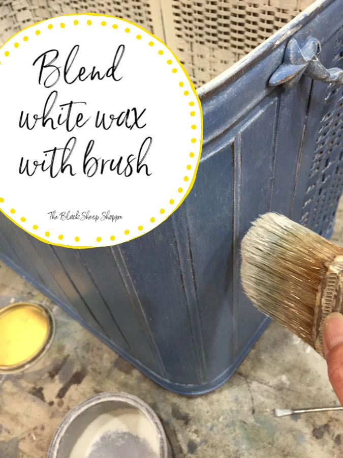 Use a brush to distribute and blend the white wax. Add more as needed.